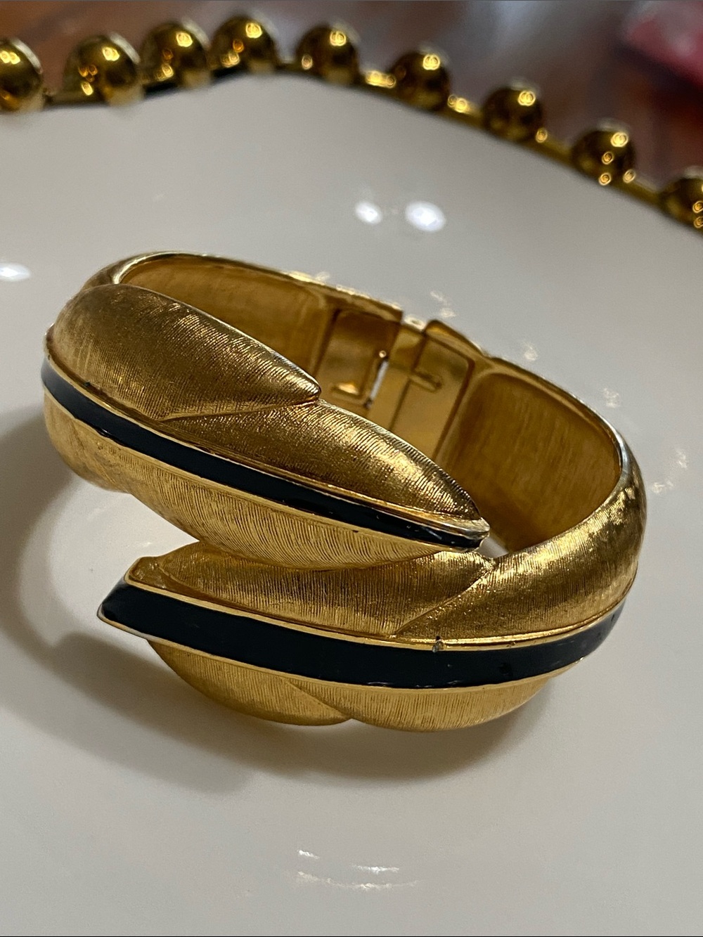 Monet Gold Tone Cuff Bracelet with Black Enamel Stripes